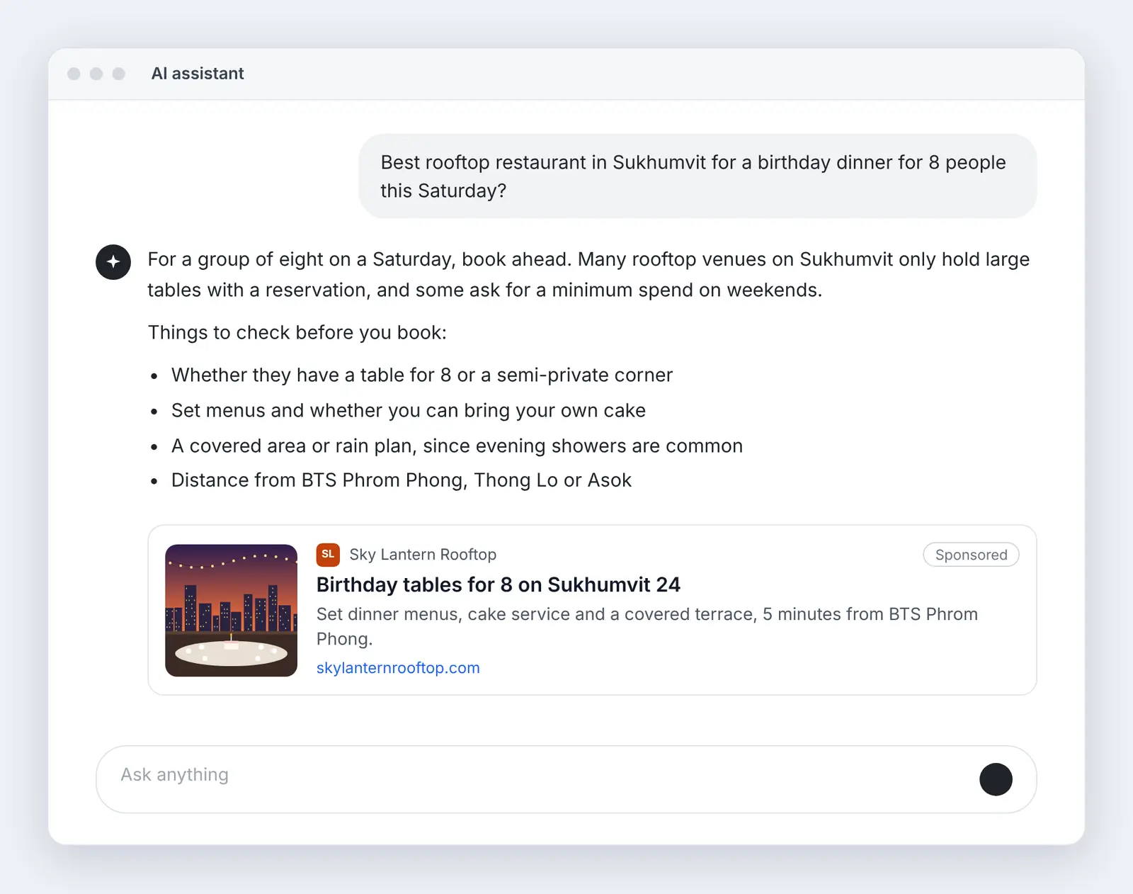 AI chat where a user asks for a rooftop restaurant in Sukhumvit for a birthday dinner for 8, with a sponsored ad for a fictional rooftop venue near BTS Phrom Phong below the answer.